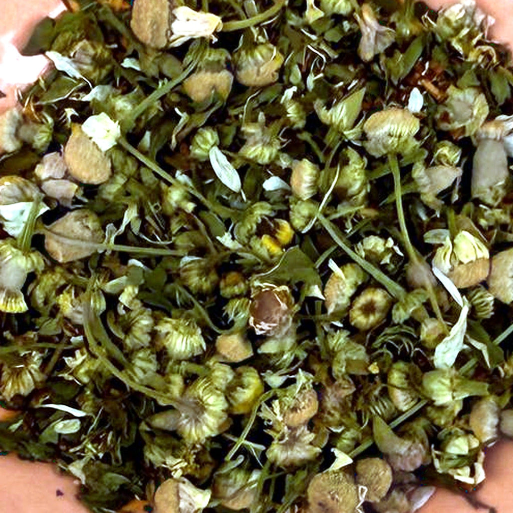 Close-up of Lillian's Shag Dancing loose tea leaves with chamomile flowers